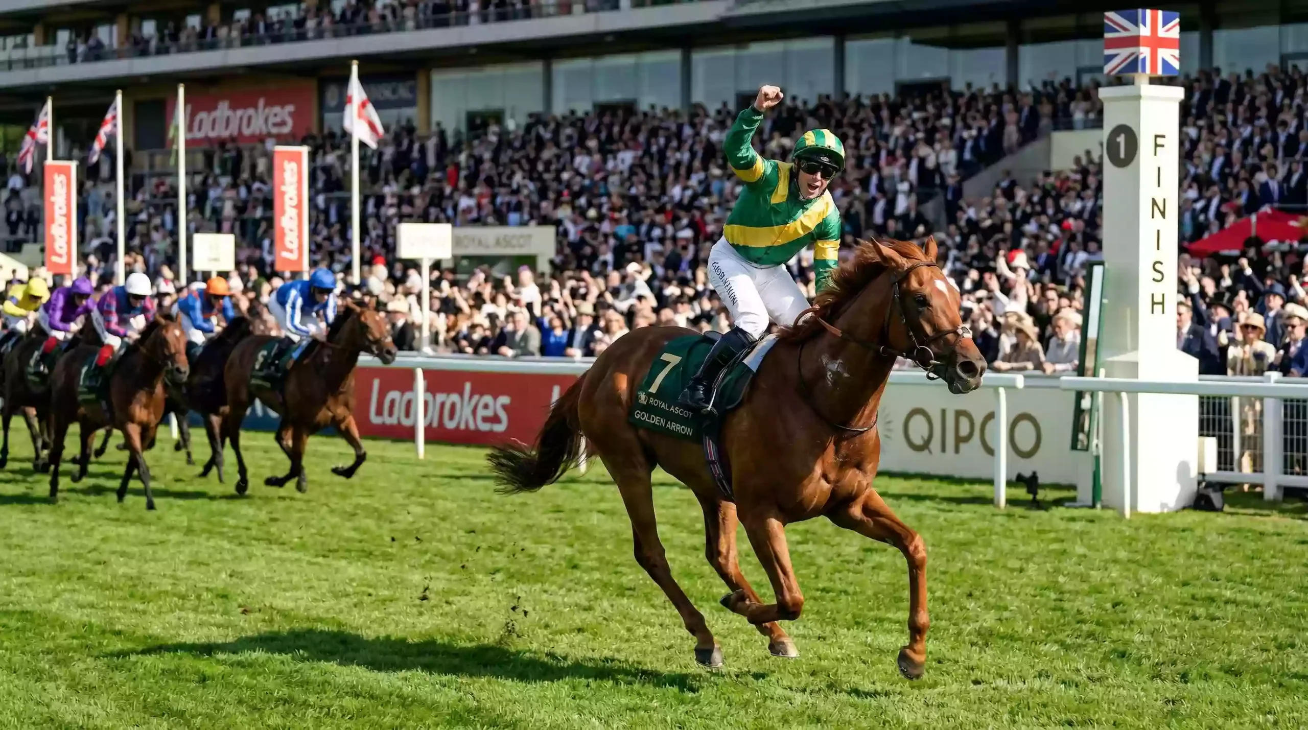 Favourite horse crossing the finish line ahead of the field on a UK racecourse